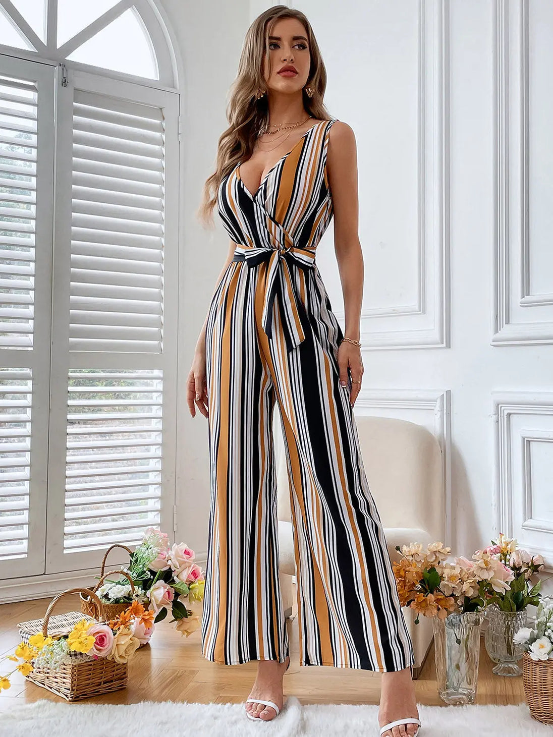 Striped Surplice Neck Sleeveless Wide Leg Jumpsuit Trendsi