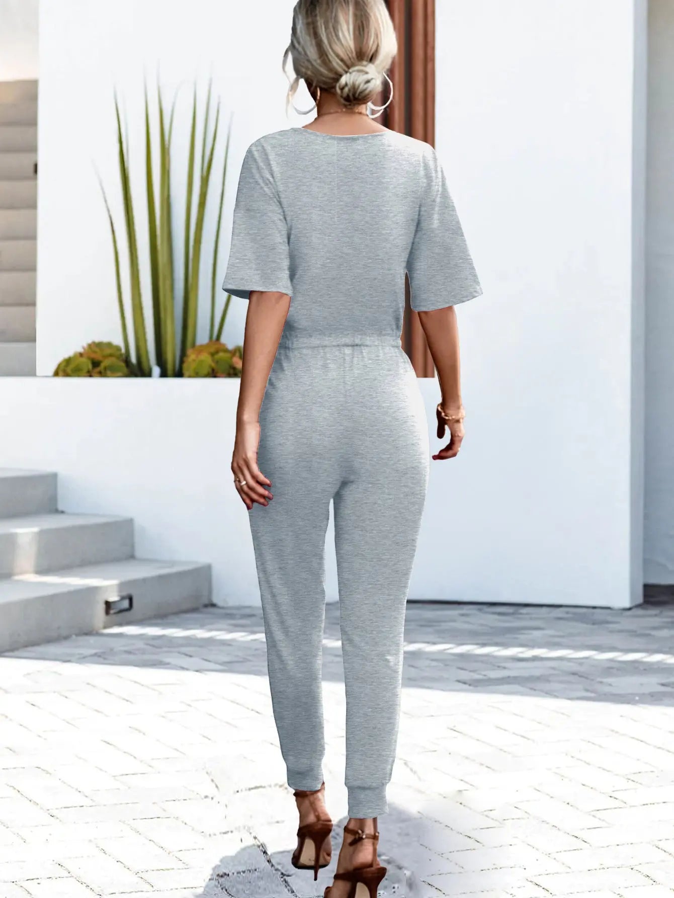 Buttoned Half Sleeve Round Neck Jumpsuit Trendsi