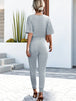 Buttoned Half Sleeve Round Neck Jumpsuit Trendsi