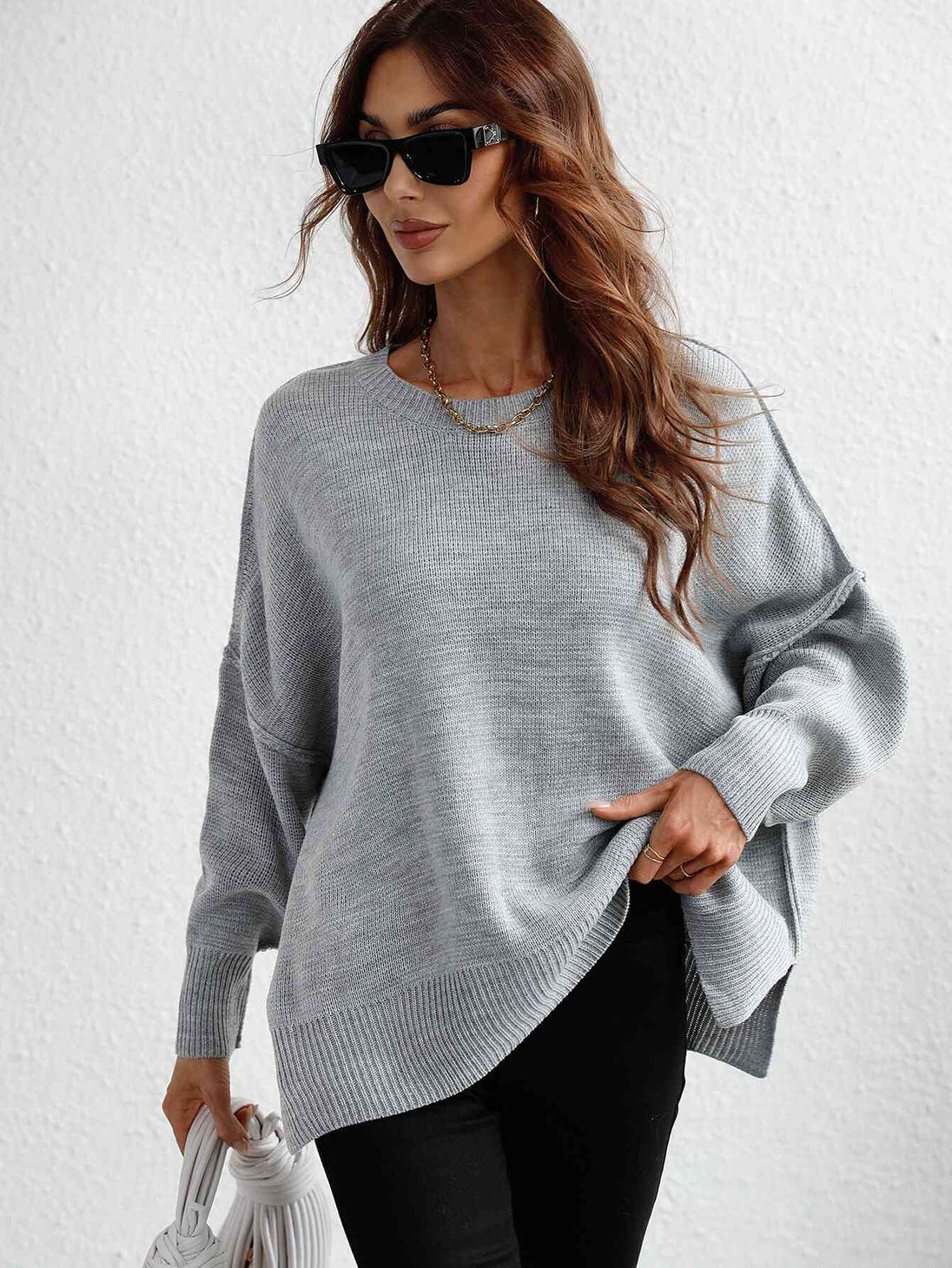 Exposed Seam Dropped Shoulder Slit Sweater Trendsi